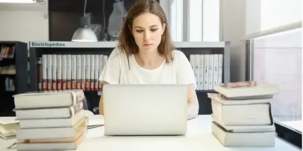 Author signing books at a publishing fair